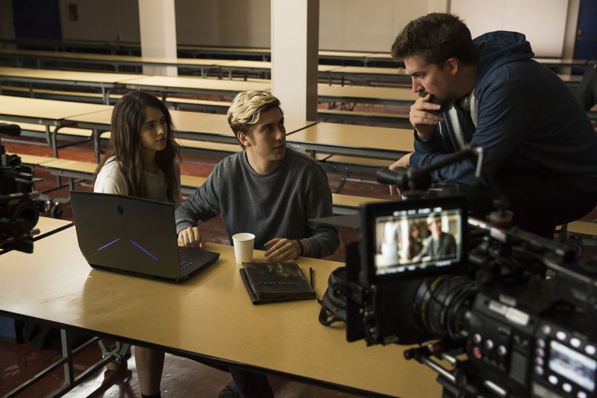 Director Adam Wingard speaks with Nat Wolff and Margaret Qualley on set