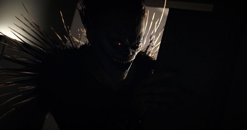 Ryuk's demonic shadowy face grimaces
