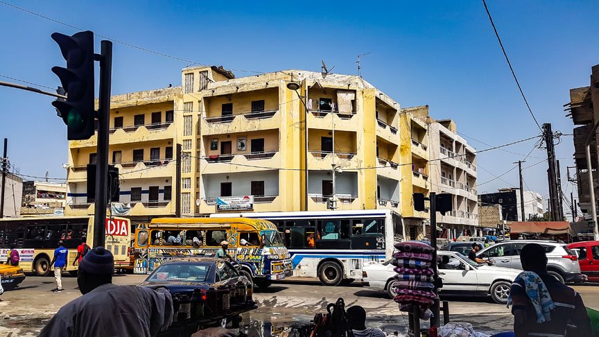 Cars and busses fill the streets.