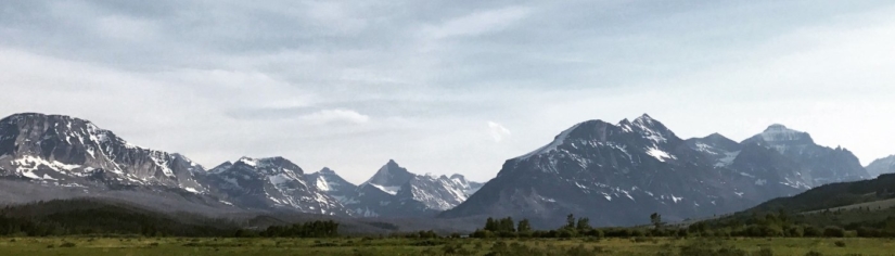 A mountain range fills a panoramic view.