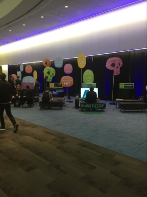 People sit around the Day of the Devs booth