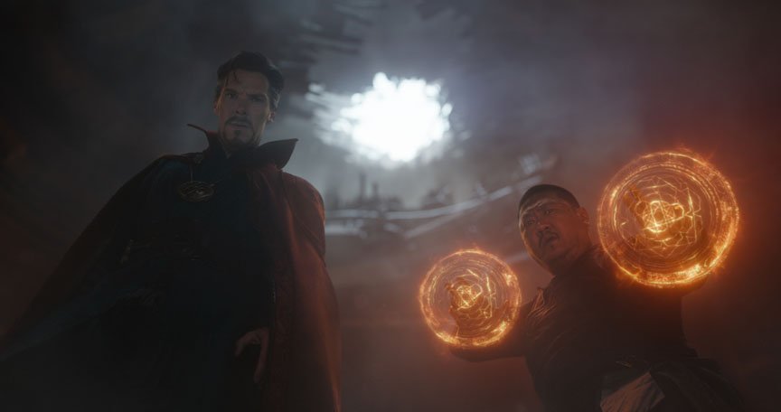 Doctor Strange and Wong look down intently.