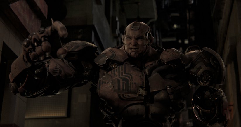 Grewishka is a massive cyborg with huge muscly metal arms and tattoos.